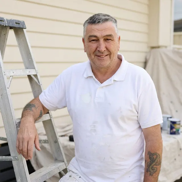 Des Callan, owner of Profile Painters QLD, on site in his painting whites