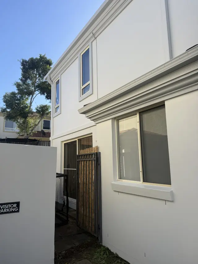 The same side elevation repainted in fresh white